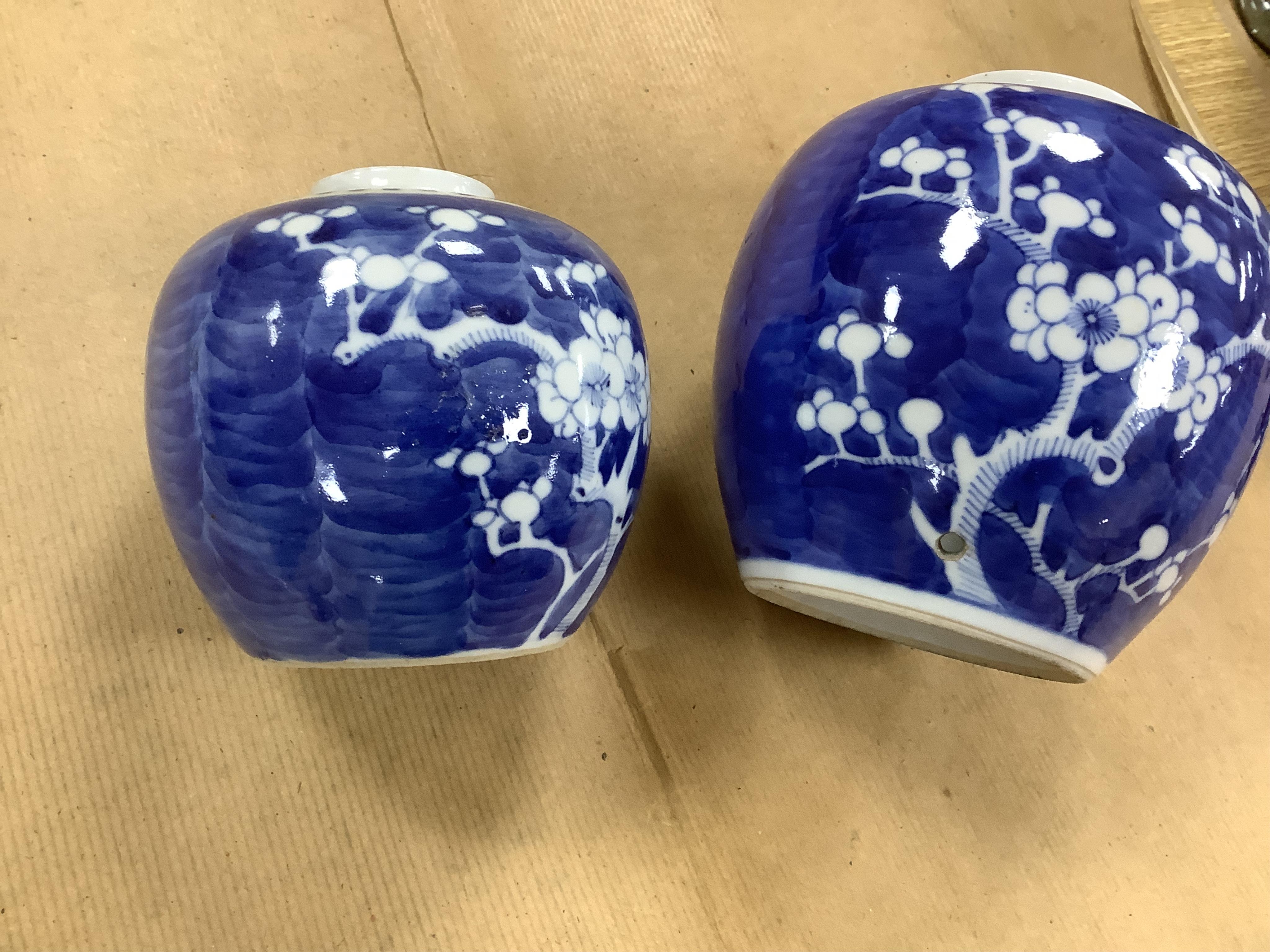 Six Chinese blue and white ginger jars, of varying height, one with a cover. Jar and cover 15cm high. Condition - fair